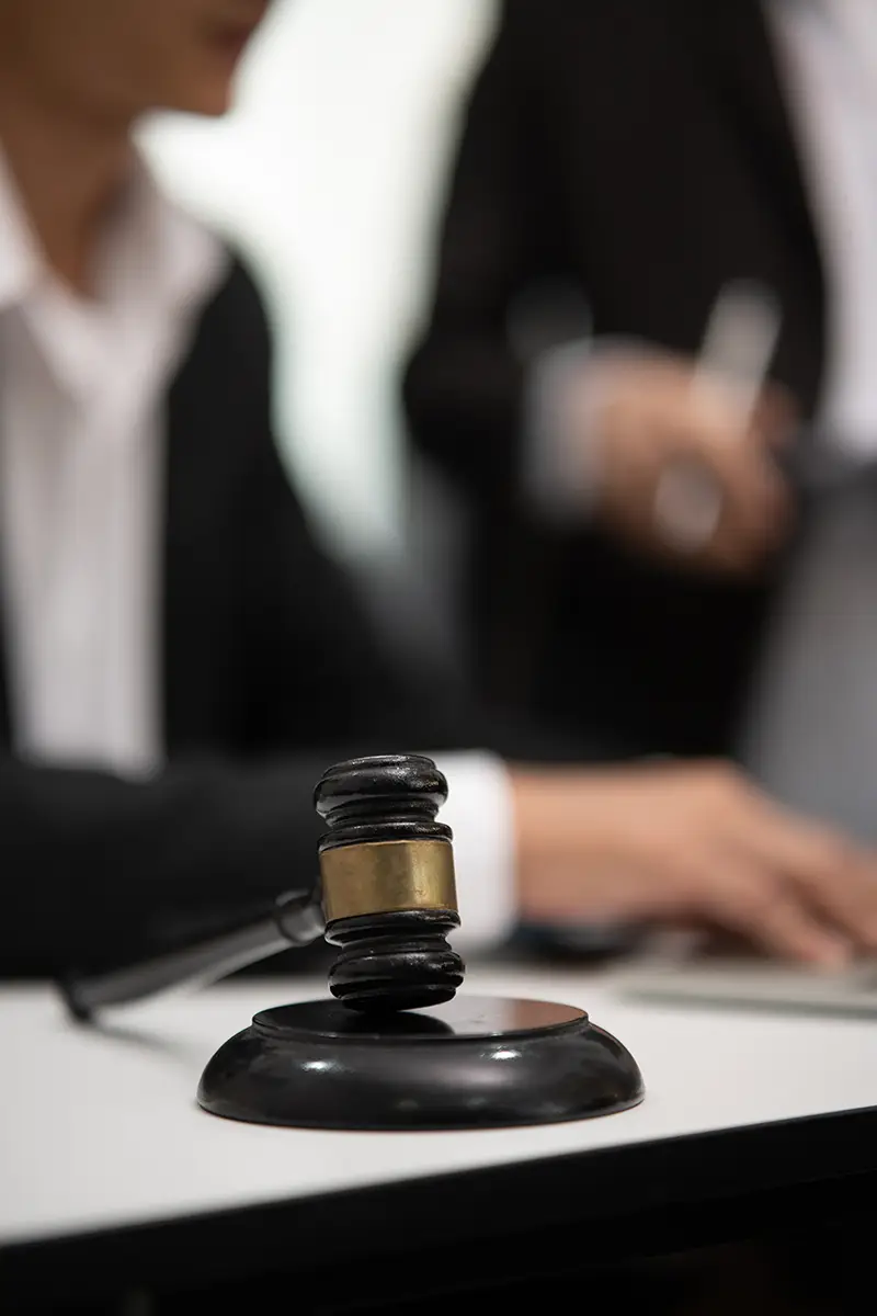 judge gavel with justice lawyers having team concepts of law and