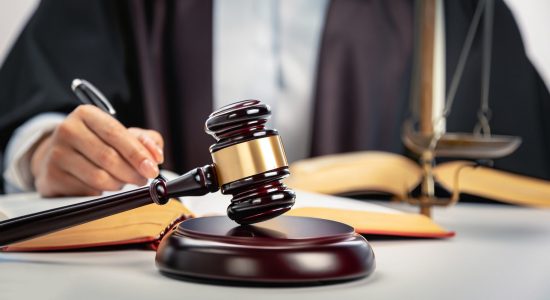 Judges hammer and legal advice figures on the table