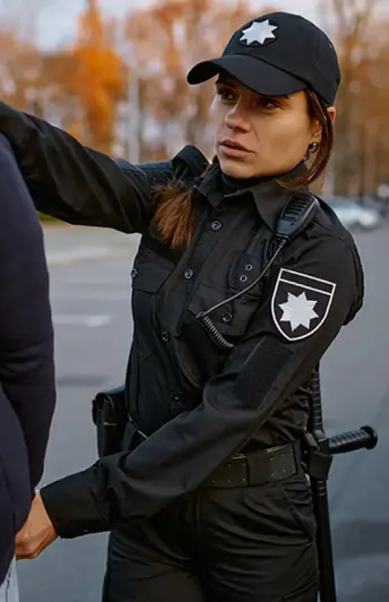 Police officer arresting a person, handled by Lori Beck Law Office for criminal defense in Denver.