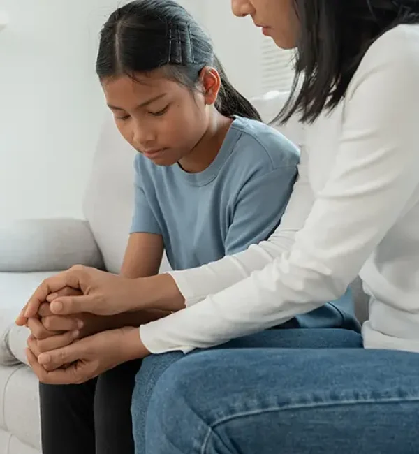 Mother comforting a young child, symbolizing support for families facing juvenile legal issues; Lori Beck Law Office in Denver, CO.